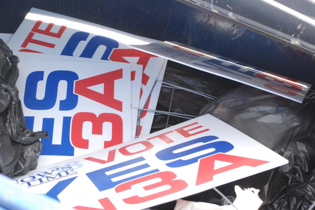 In the dumpster behind Lewis-Palmer High School a lot of “Say Yes to 3A” signs were thrown away. 