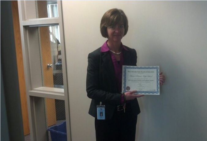 Mrs. Brandl holding the LPHS John Irwin Award