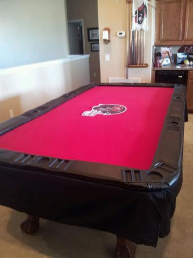 a poker table that fits inside of a pool table.