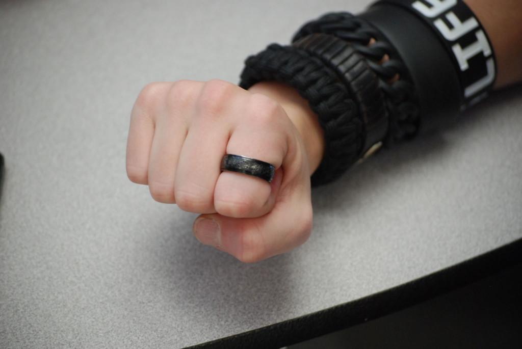 Junior, Grayson Sharp proudly shows off the black decorative ring that he wears everyday.