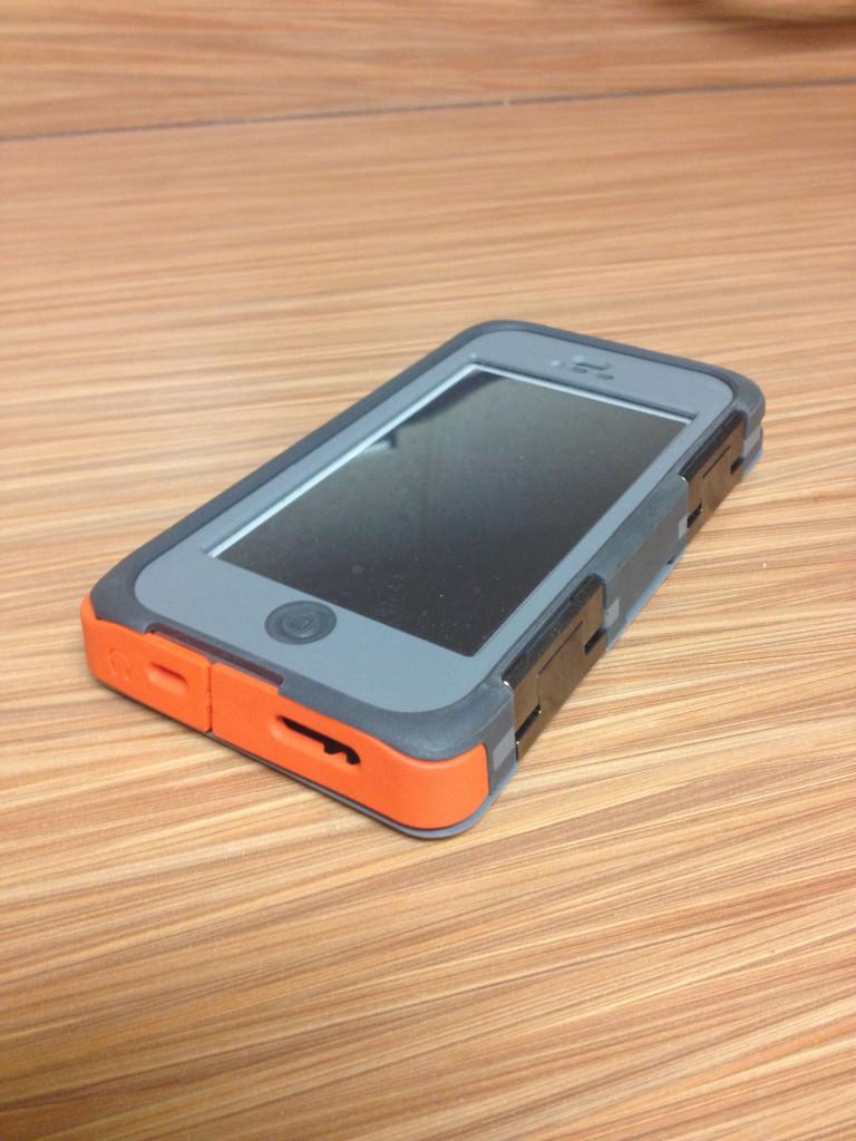 A first edition Iphone 5 in an Armor Series Otter Box phone case.