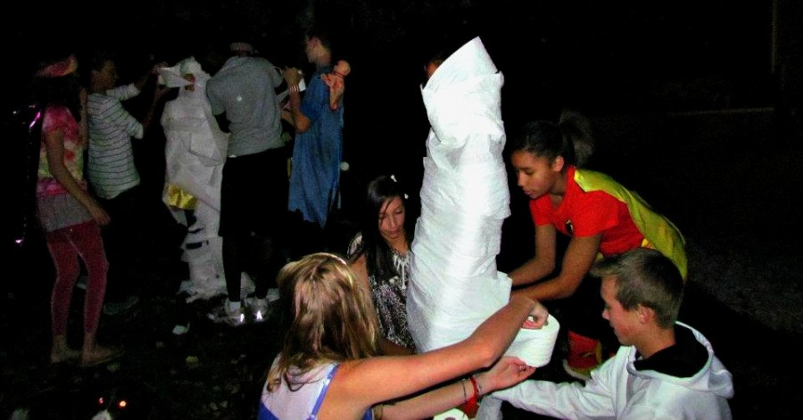 One of the most popular Halloween games, the mummy wrap.