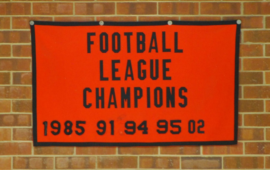 A banner boasting the league championships that Coach Ramunno has under his belt.