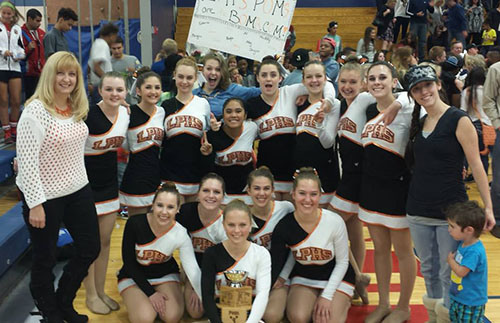 The Poms team poses with their first place trophy after becoming the PPAC champions.