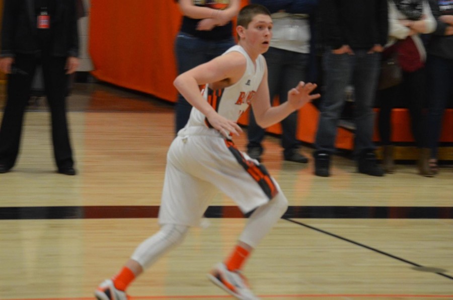 Andrew Blomberg running across the court during a home game at Lewis-Palmer High School. 