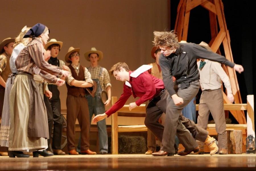 Spencer Randell and Kole McKay act out a fight scene in the fall musical, Oklahoma!