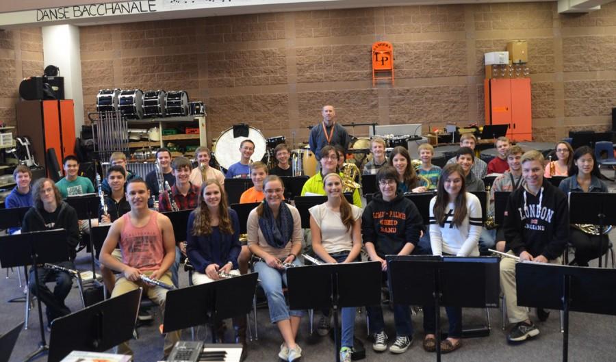 The Wind Symphony sits in the band room for practice with Kevin Whitelaw