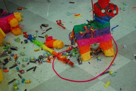 Candy spilled to the floor after a piñata was smashed.