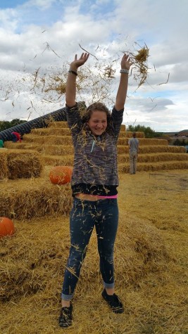Melaney Cook, 9, rejoices in the spirit of fall harvest.