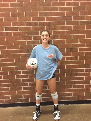 Bartalo poses with a volleyball before practice.