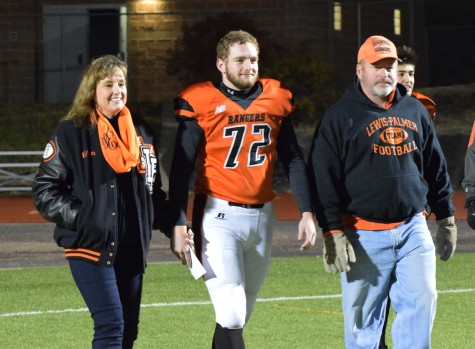 Senior, Ryan Earl is presemted with his mother, Vicky and father, Chris.