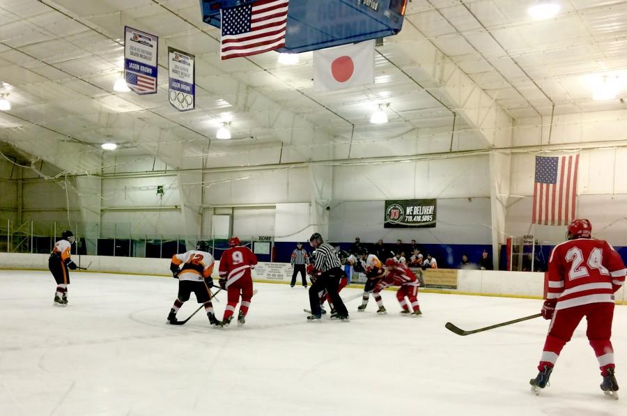 Lewis-Palmer hockey team playing against Regis Jesuit High School.