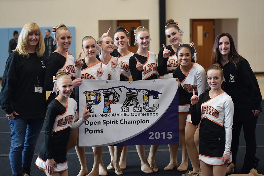 The Lewis-Palmer Poms competition team with their 1st place banner
