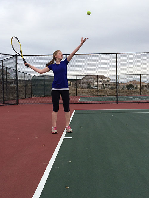 Annie Ackerman,  9, practicing her tennis serve. 