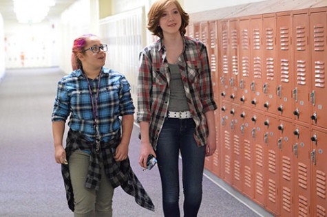 Brynna Simonoff, 11 and Kate Lindsay, 10, wander the halls in their plaid shirts for Lumberjack Day.  