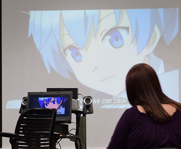 Brynnon Elmer,9 , watches anime during one of the weekly meetings.