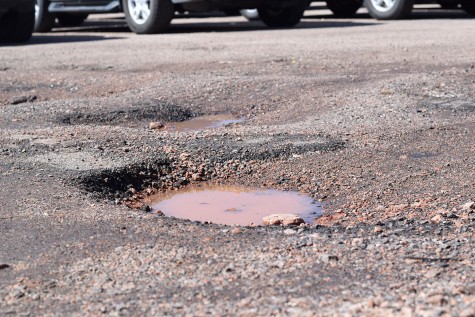 One of the many potholes in the Lewis-Palmer student parking lot.
