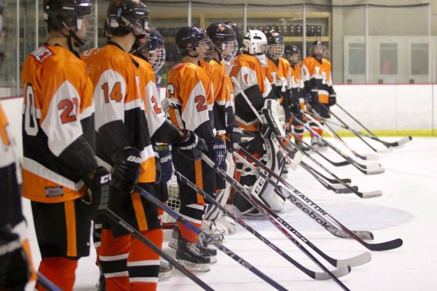 Photo taken by Isaac Colby.  The Lewis-Palmer High School hockey team stands at the ready for their first game