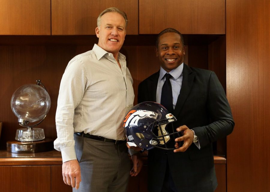 Vance Joseph standing next to John Elway after confirming Josephs position as the Broncos new head coach.