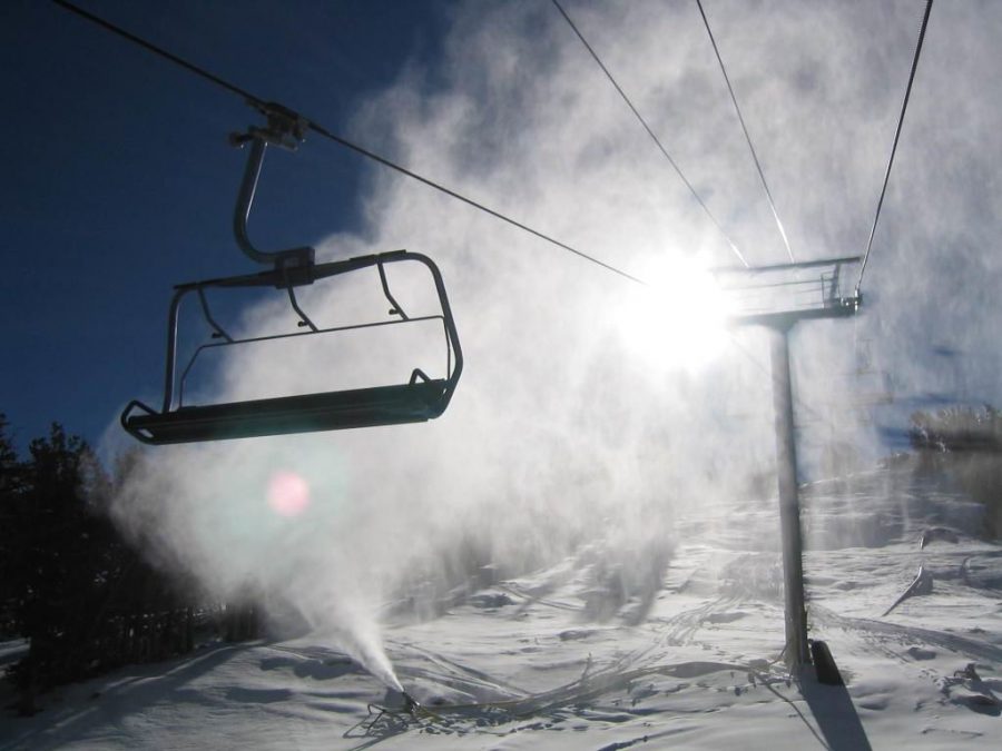 Riding up the ski lift to get to the top, to shred the fresh powder.