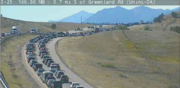 Traffic backs up on I-25 on Saturday September 30 as the Douglas County Sheriffs Department shuts down the right lane heading southbound after finding a body near the Greenland road exit.