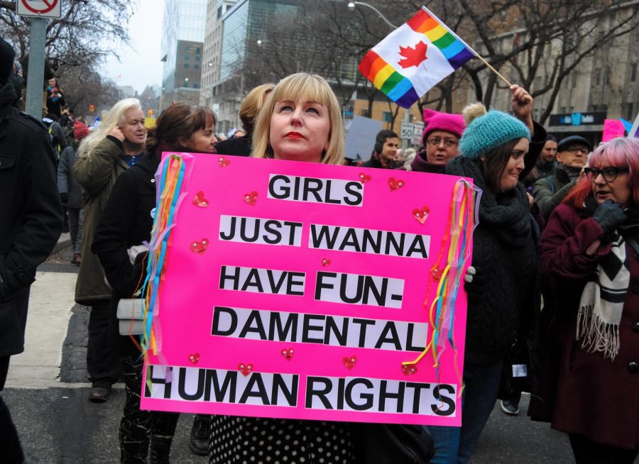 A woman holds up a sign  in support of womens rights at the Womens march in New York City. 