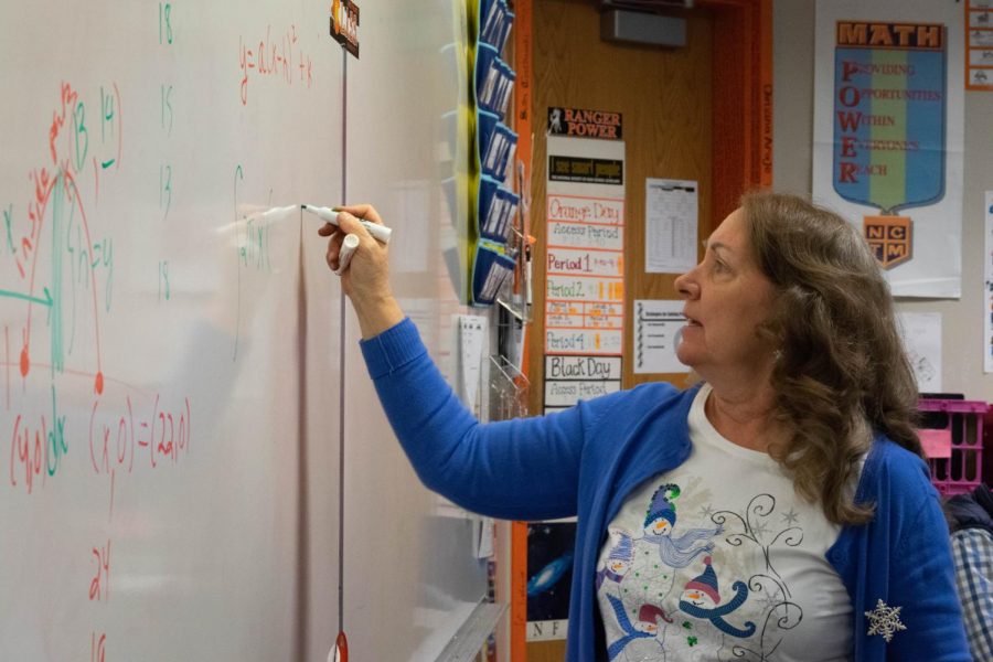 Thirkell explains a homework problem in AP Calculus. Students in her class saw 5 to 20 percent increased performance on their tests after participating in the Emergenetics program. 