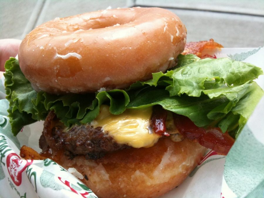 One of the restaurant’s more popular items, the Luther Burger, consists of doughnuts for buns and and a fried egg. Crave Real Burgers, created by Jeff and Jeryn Richard, opened for business in 2010.  Picture Credits: Creative Commons