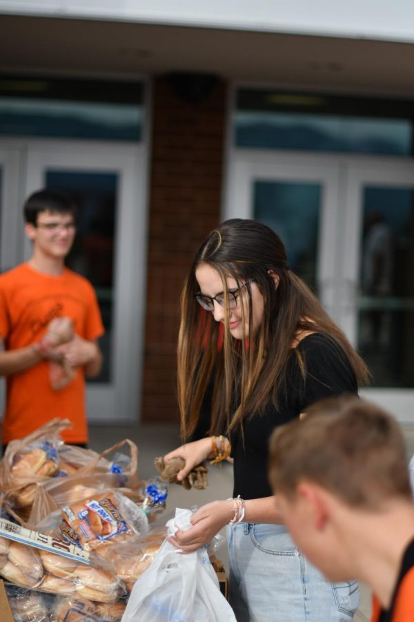 Students eat burgers and hot dogs, prepared by 
teachers, at the Link sponsored barbeque. “I think the leaders really took in their leadership abilities, Miller said. I would say that it went the way I had hoped.”