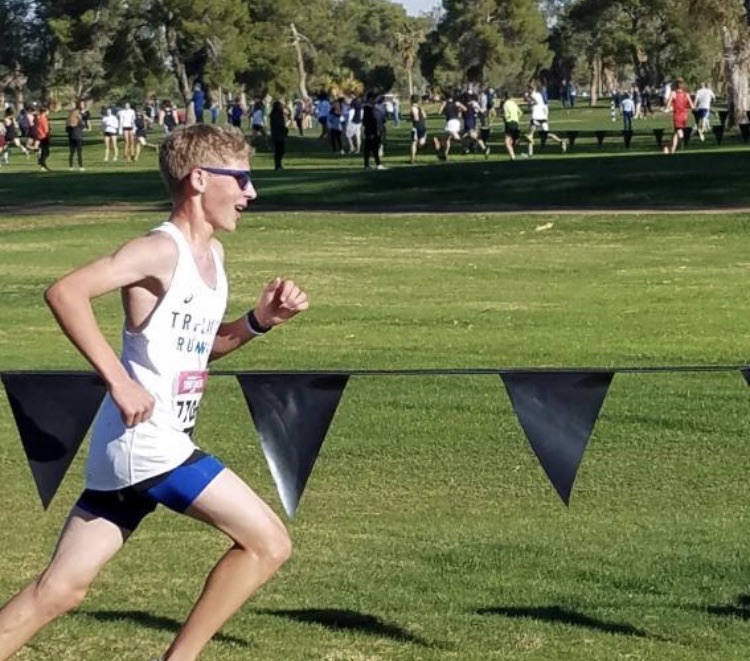 Eli Cook 11 runs in a cross country race for his Tri-Lakes Runners Club. “I have run cross country for two years. What I enjoy most about cross country is competing with other schools and having fun with my friends,” Cook said.