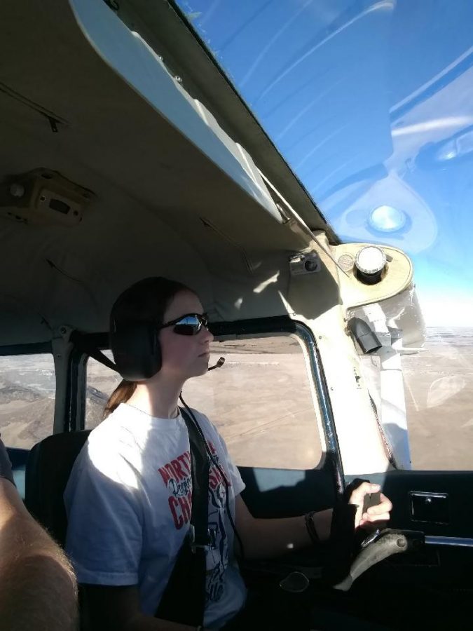 Shelby Lashley 11 flies a Cessna 172 over Larkspur, Colorado. “Once you get above 5000-6000 feet, birds arent really an issue, as they dont tend to fly up that high,” Lashley said. “Youre always on the lookout whenever you make a turn, so you always look, just like if you were in a car. Its more of a 180 look instead of just left and right.”