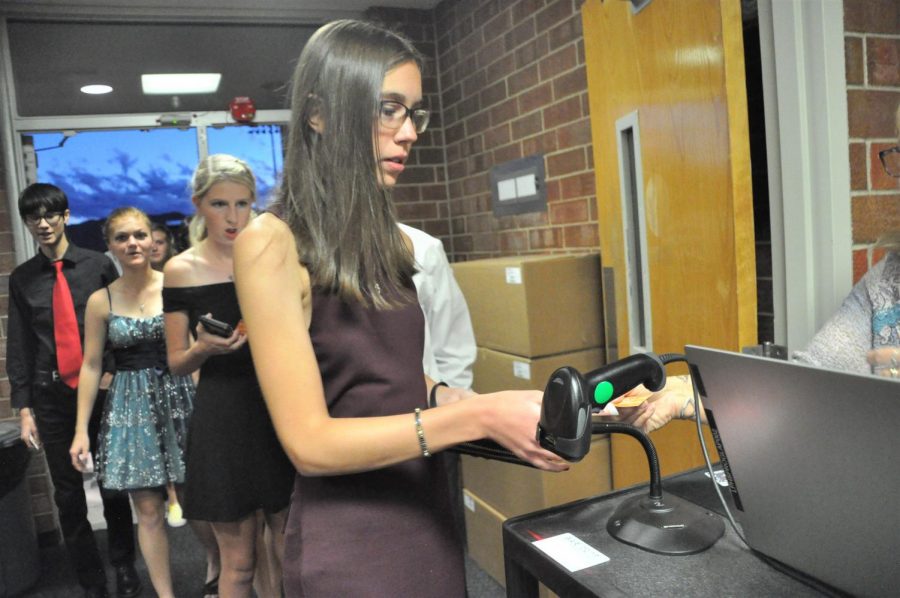 Students line up to scan their homecoming tickets before the dance starts.“We didnt have anything last year and a lot of kids that bought tickets were sophomores, who didnt get to have any high school experiences last year,” Carrie Coates SS said. “Lifes gotten a little bit back to normal and they wanted to be part of that.”

