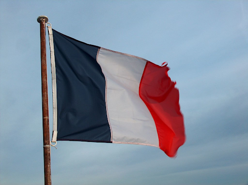 The new French flag flies on a rusted flagpole. It has existed for almost all of modern French history and has a dark shade of navy, compared to the EU’s Marian Blue. The President of the Republic has chosen for the tricolour flags that adorn the Élysée Palace the navy blue that evokes the imagination of the Volunteers of Year II, the Poilus of 1914 and the Compagnons de la Libération of Free France, said a statement from the Presidential Palace.
