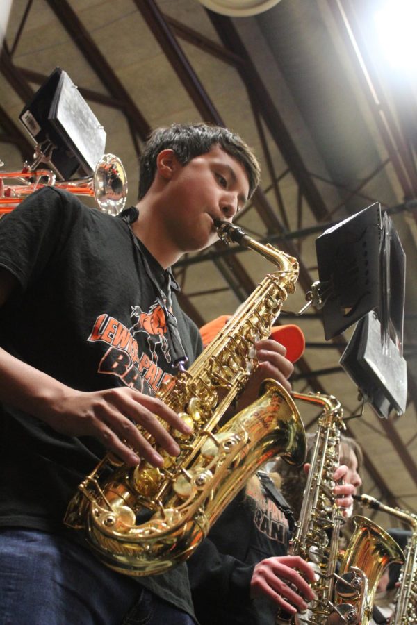 Trevor Arcarese 10 plays alto saxophone at the LP vs PR basketball game for the Pep Band. Arcarese has been playing saxophone for 3 years and he fell in love with the unique instrument the first time he heard his friend playing it. “The alto sax was created very recently, it has good tone quality so basically I think it just sounds the best out of all of them,” Arcarise said.
