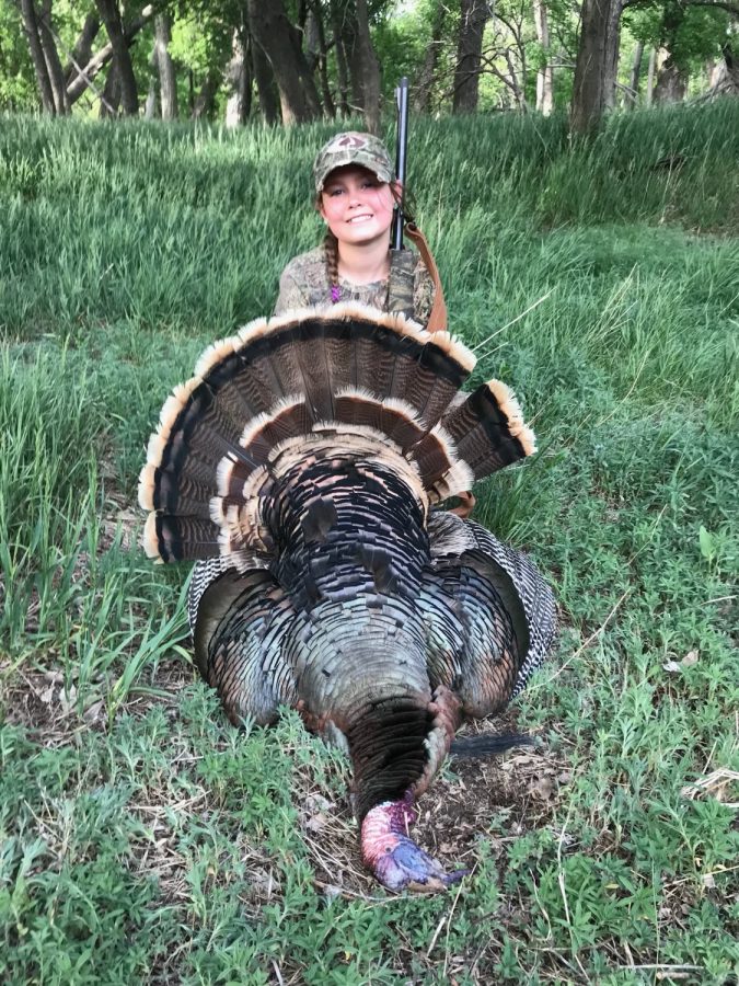 Hope+Lacy+9+shows+off+a+turkey+that+she+killed+with+her+dad+last+year.+She+enjoys+hunting+and+feels+that+it+is+a+way+to+have+fun%2C+but+still+do+what+you+love.+