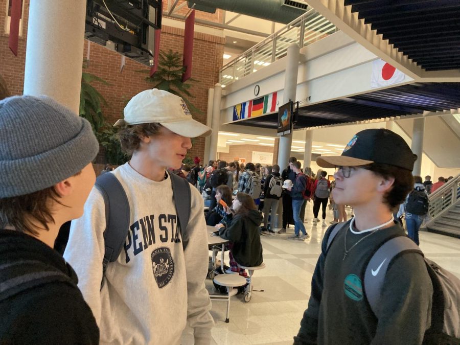 Students take advantage of new dress code allowance of hats before first period. Restrictions have been reduced due to popular opinion, although hoods remain banned from school.