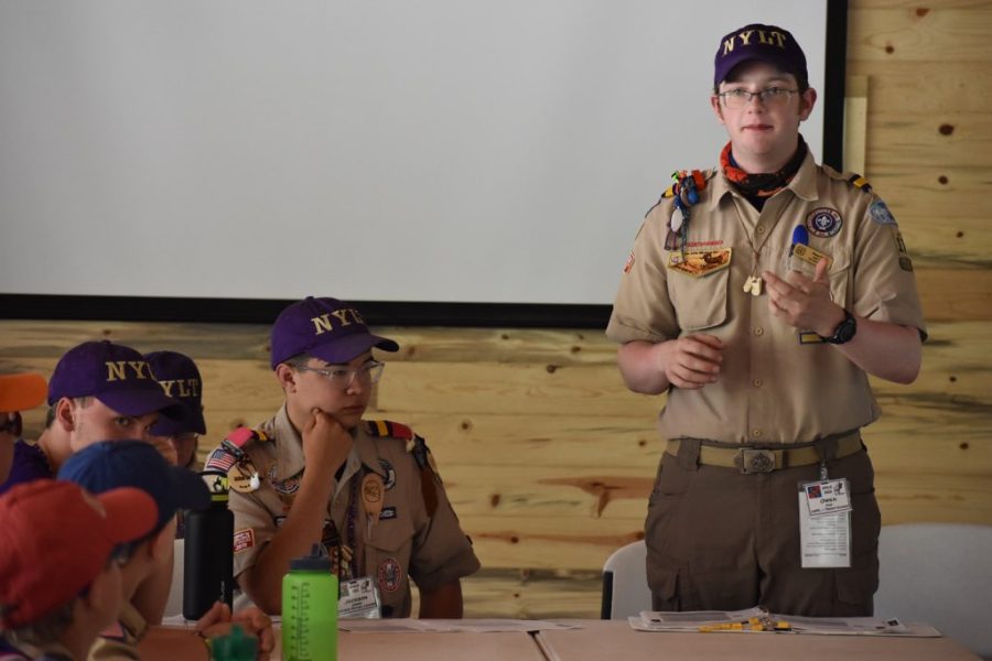 Owen Pike 12 gives instructions to the troop leaders, as they prepare for the participants of the National Youth Leadership Training to come. Pike is enjoying his remaining time as a Senior Patrol Leader, having worked his way up to the position after five years.